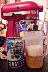 Sam 76 beer can next to a measuring cup with the beer poured in, in front of Kitchen Aid Mixer