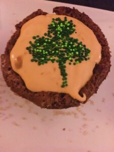 Shamrock Pot O' Gold Guinness Brownie with Caramel Irish Whiskey mousse with green sprinkles forming a shamrock