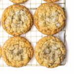 Chocolate chip cookies on a wire rack.