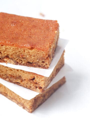 A stack of three soft and sweet butterscotch blondies dessert bars.
