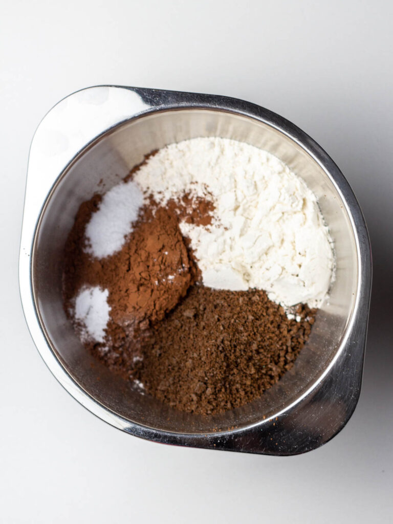 Dry ingredients in a small silver mixing bowl.
