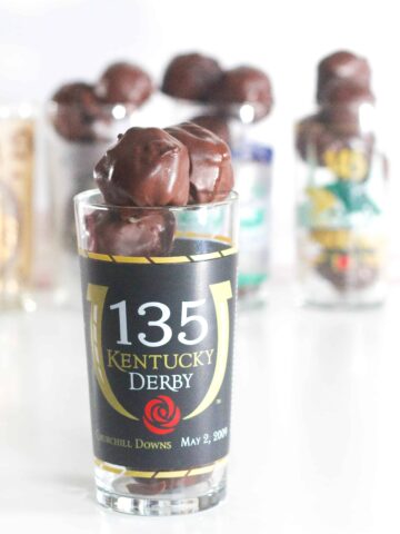 Kentucky Derby mint julep glass filled with chocolate covered bourbon balls.