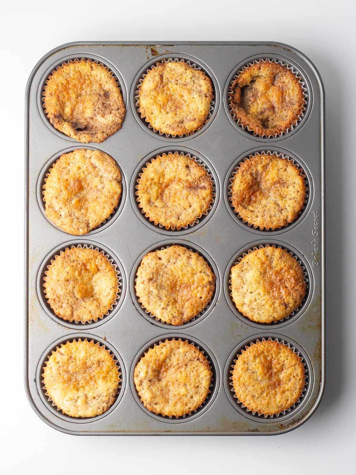 Baked cupcakes in the lined muffin tin.