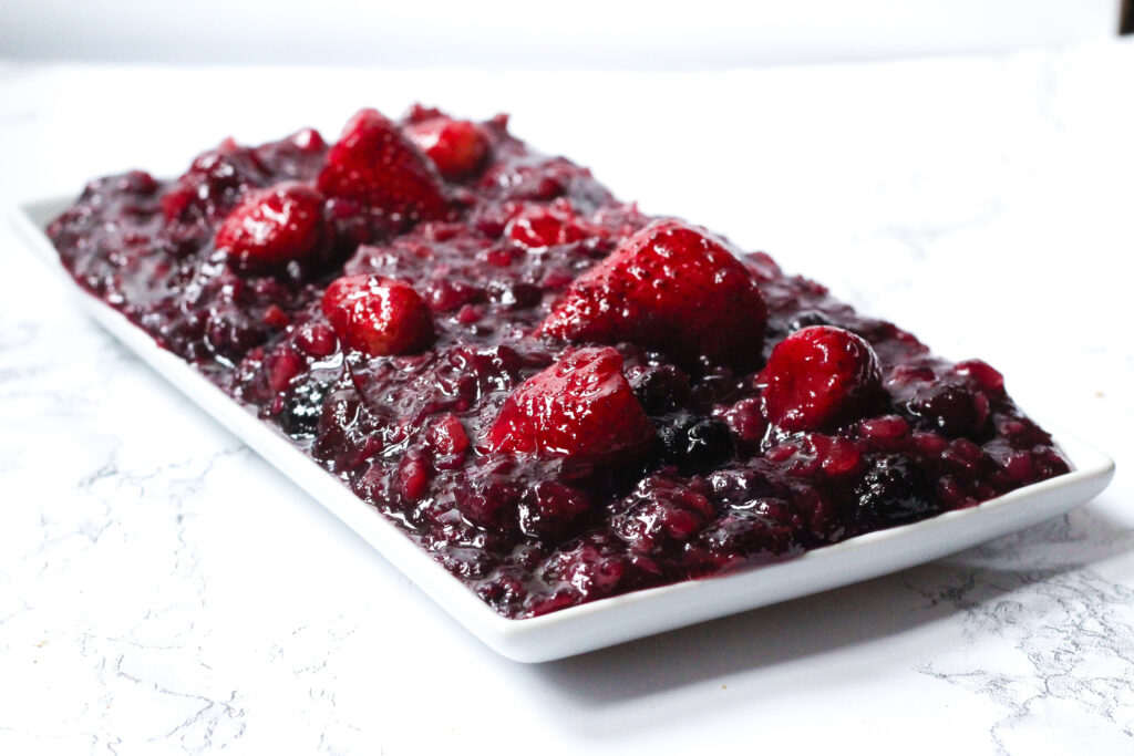 side angled view of a rectangular plate filled with simple southern cranberry sauce