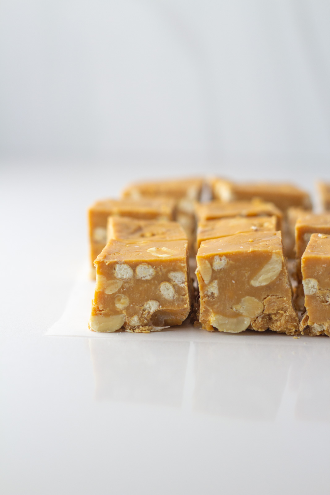 A side view of cubes of salted caramel fudge.