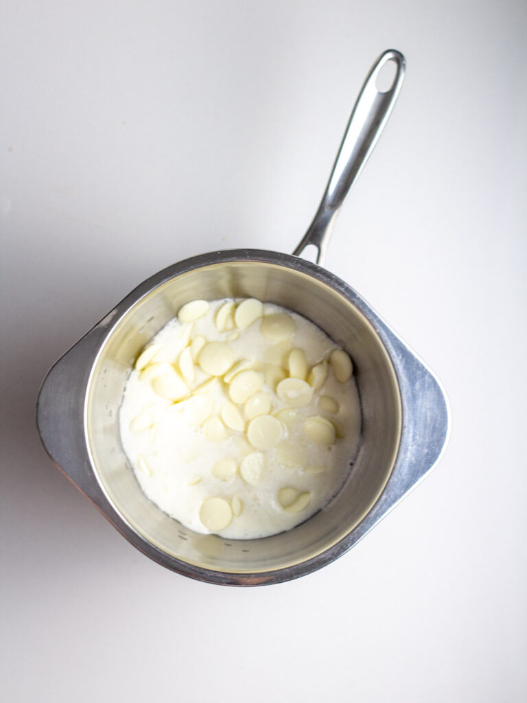 Vanilla melts, prosecco, and cream in a double boiler.