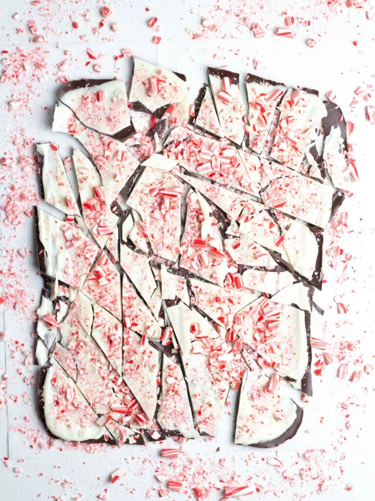 A sheet of salted peppermint bark cut into uneven pieces.