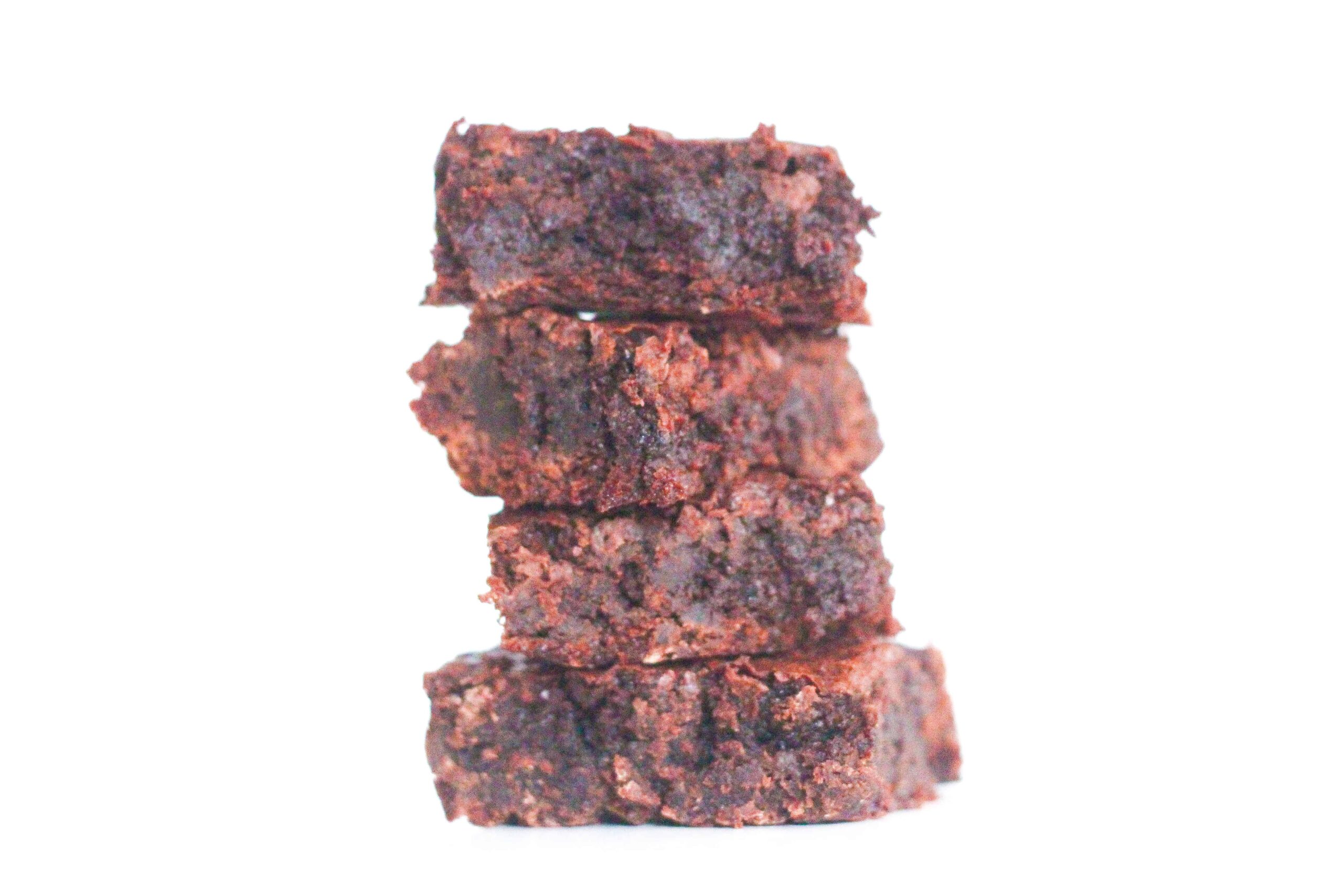 stack of 4 fudgy stout beer brownies with a white background