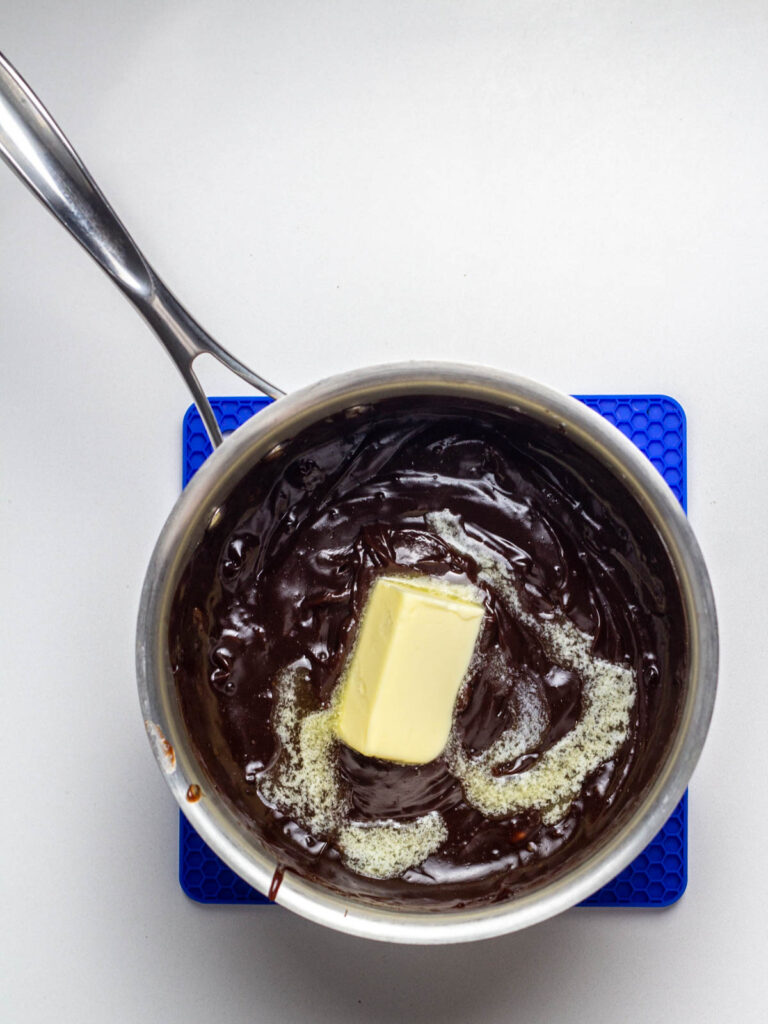 Butter melting into hot chocolate pie filling.