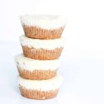 stack of four southern cocktail inspired mini milk punch mardis gras cheesecakes.