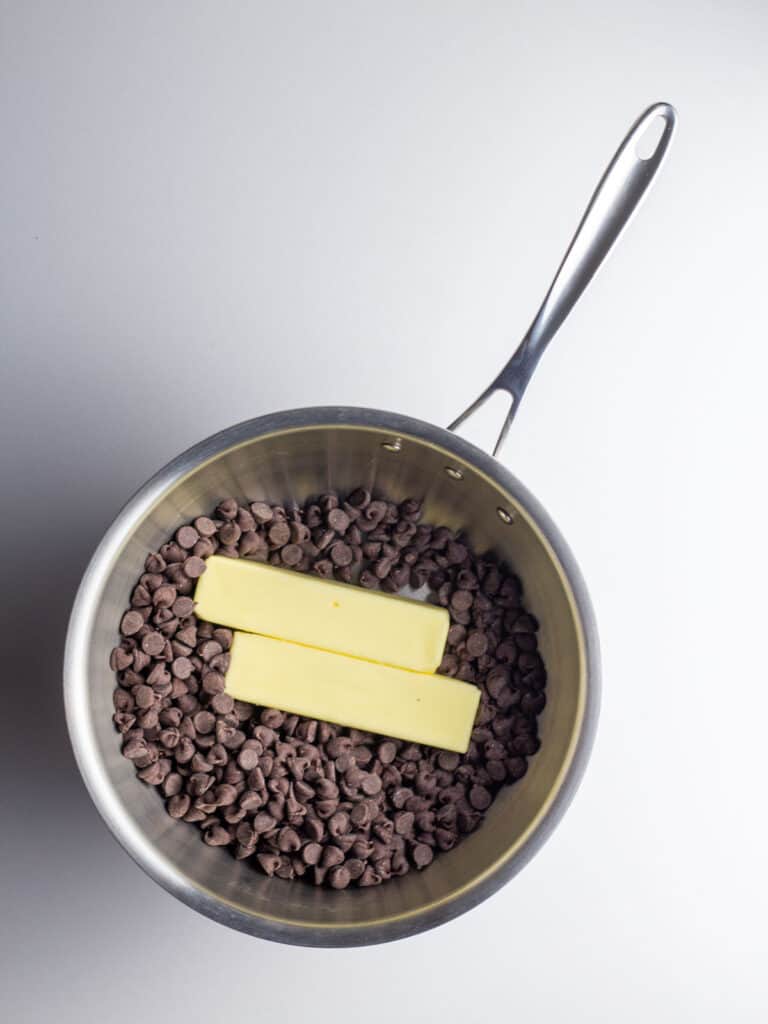 Chocolate chips and butter in a saucepan.