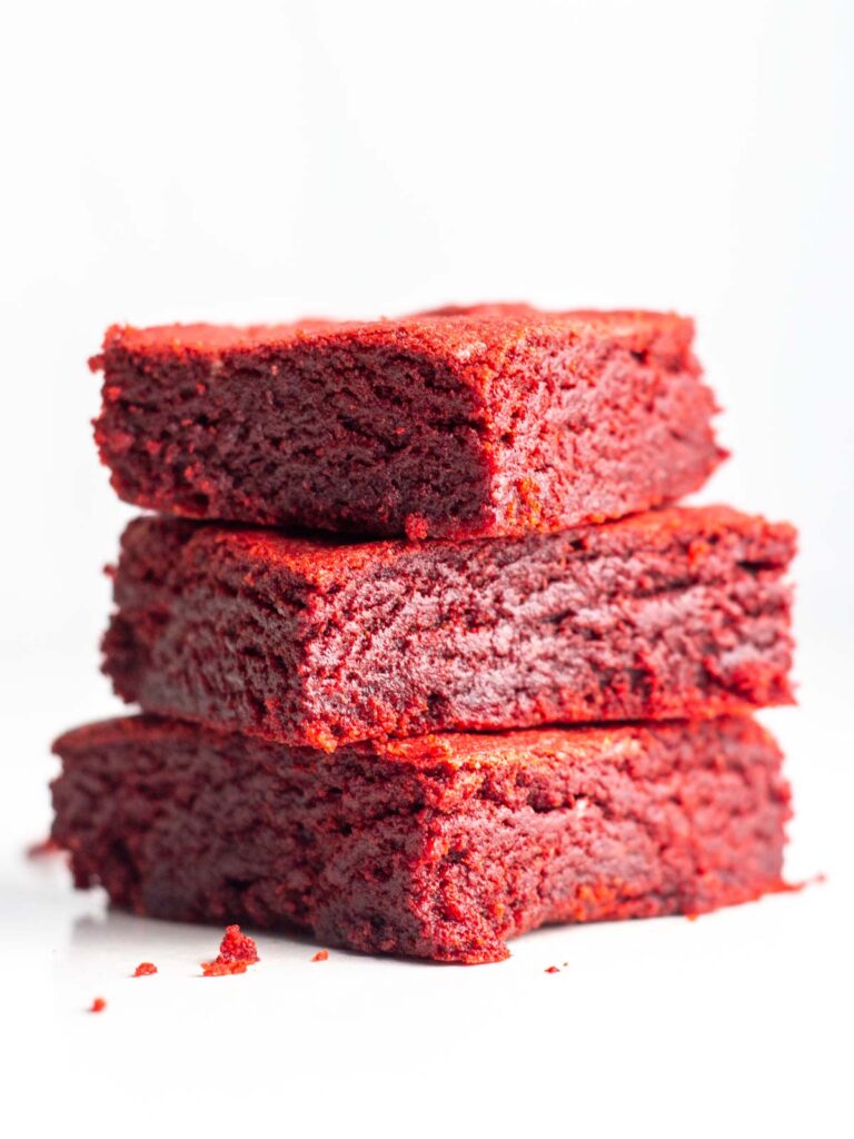 A stack of three red velvet brownies made with cake mix.