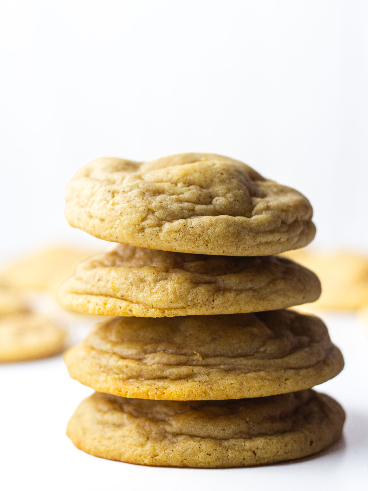 Stack of four pumpkin cheesecake cookies.