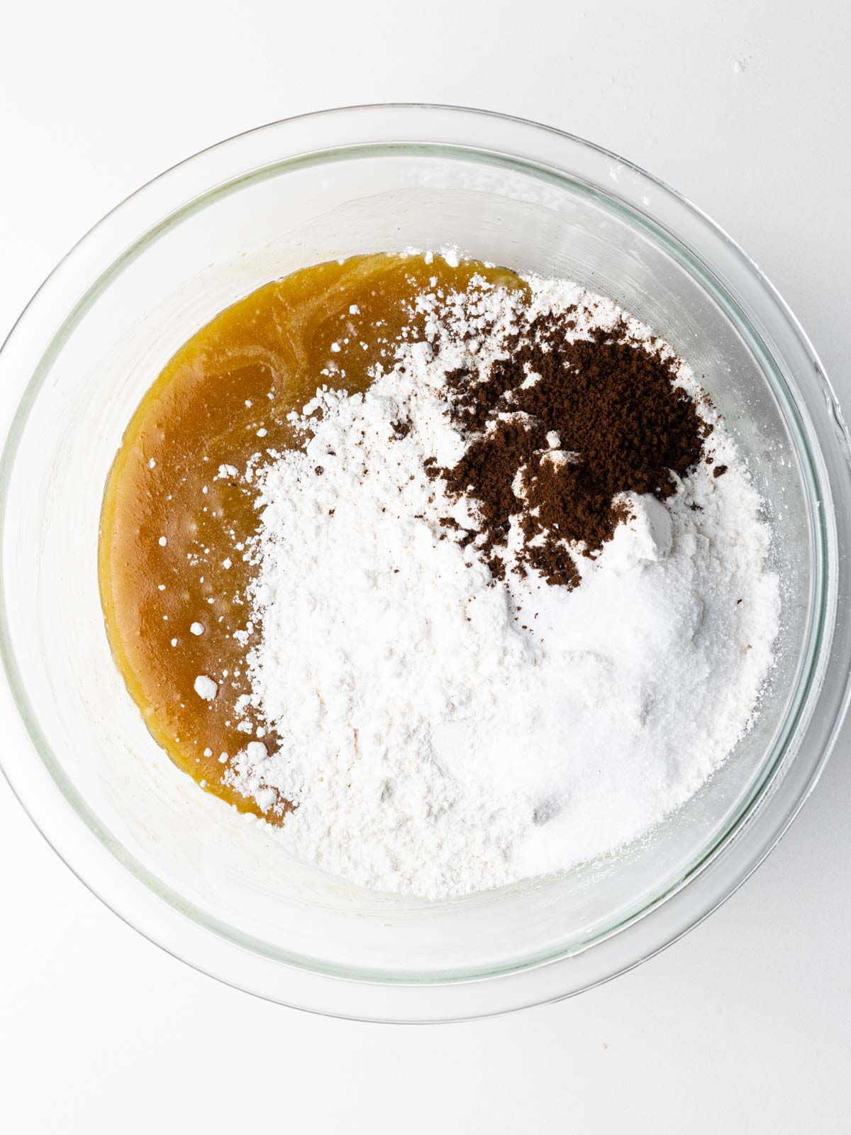 The dry ingredients added to the chocolate chipless cookie batter.
